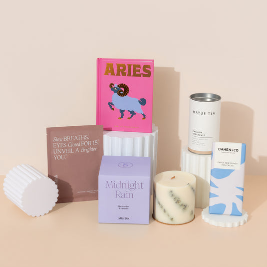 Astrology birthday gift hamper filled with zodiac book , candle, tea, chocolate  and facial mask . Curated for birthday gifts or thinking of you gifts boxes