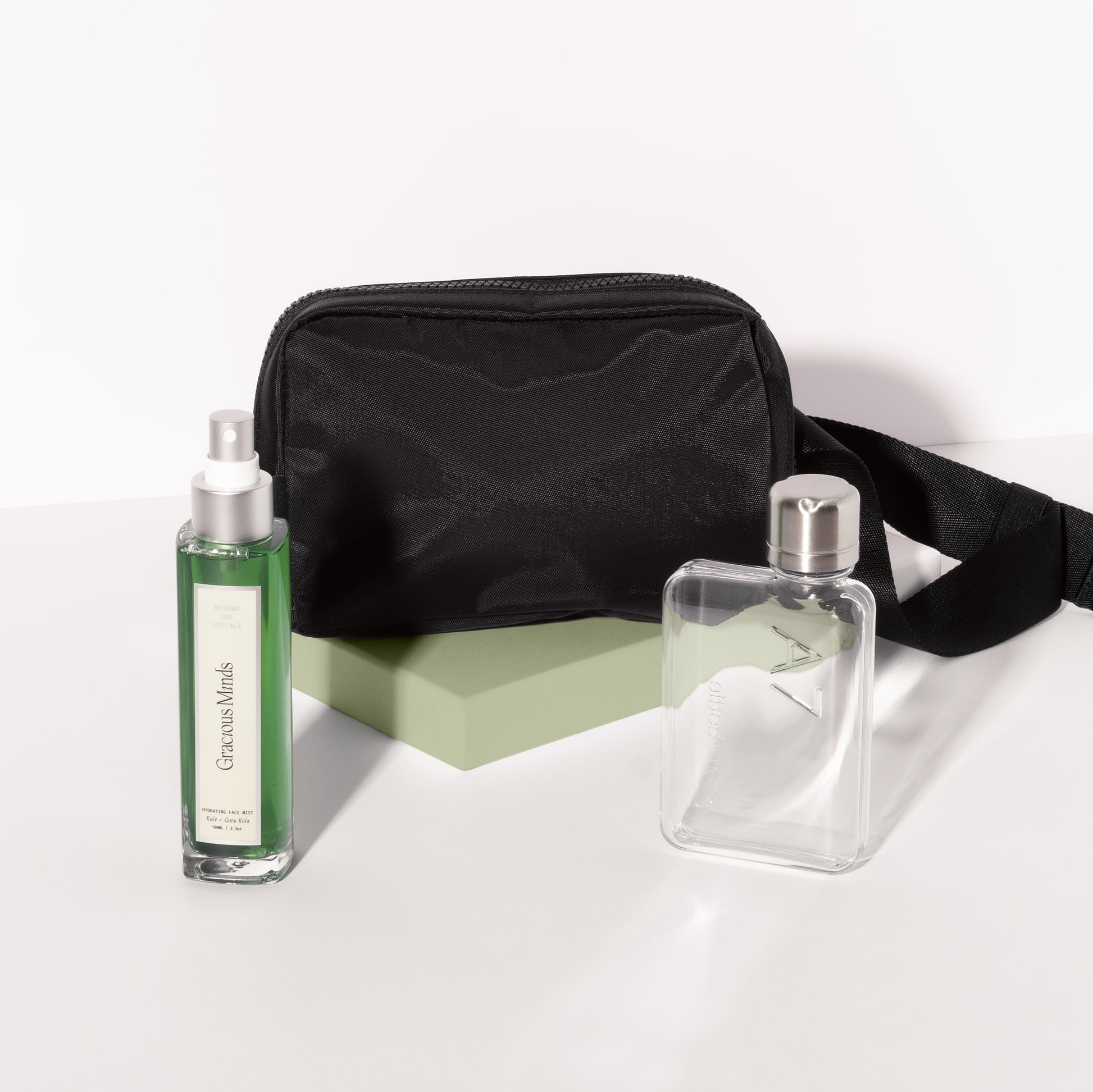 Stylish Gift Set curated for fitness lovers , featuring hydrating mist , black bum bag and reusable flask bottle 